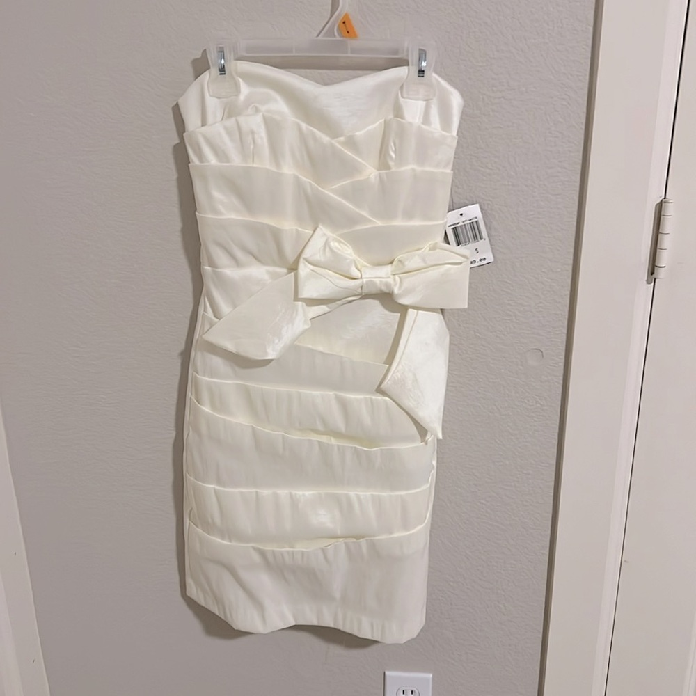 a cream strapless dress with bow